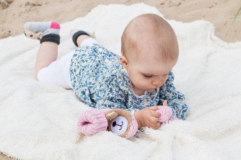 Pink SOXO baby slippers with a teddy bear